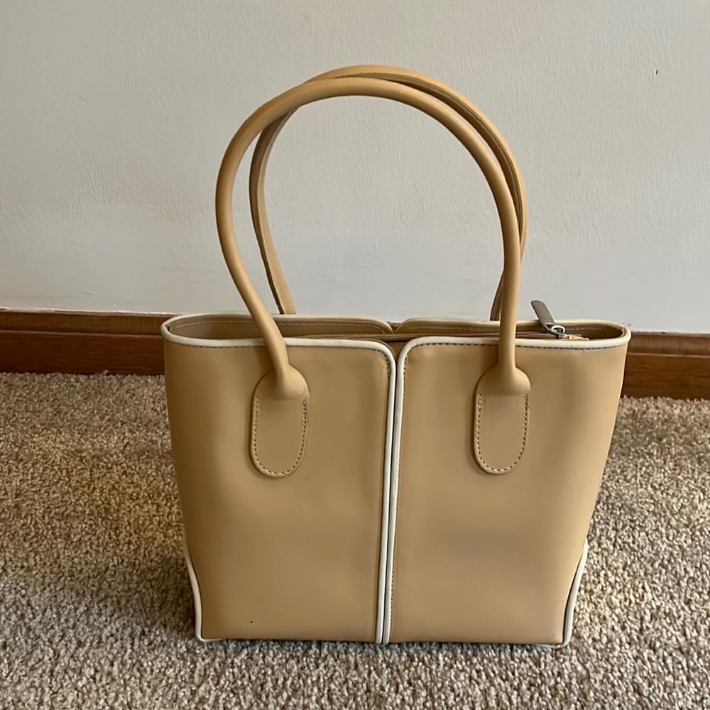 Gorgeous upscale tan leather handbag with cream piping detail